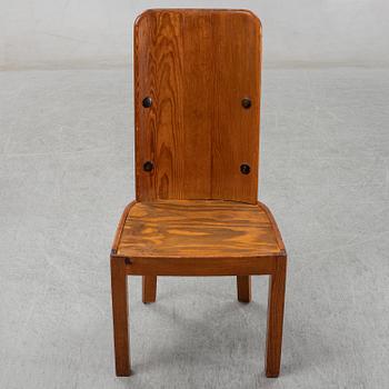 Axel Einar Hjorth, a pair of stained pine "Lovö" chairs, Nordiska Kompaniet, Sweden 1930's.