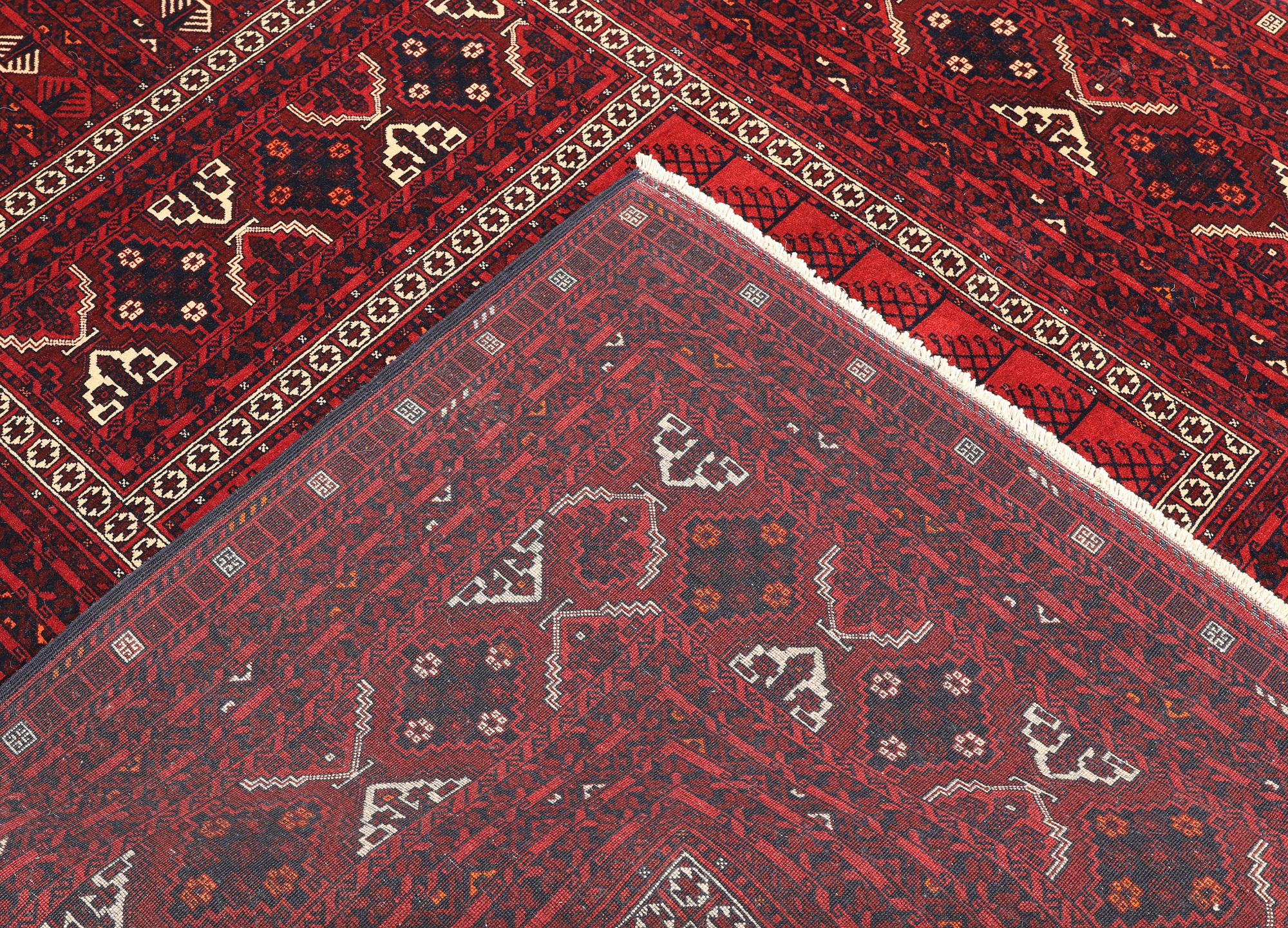 A Afghan carpet, 256 x 168 cm.