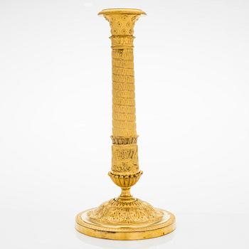 A mid 19th centry candlestick altered to a table lamp.