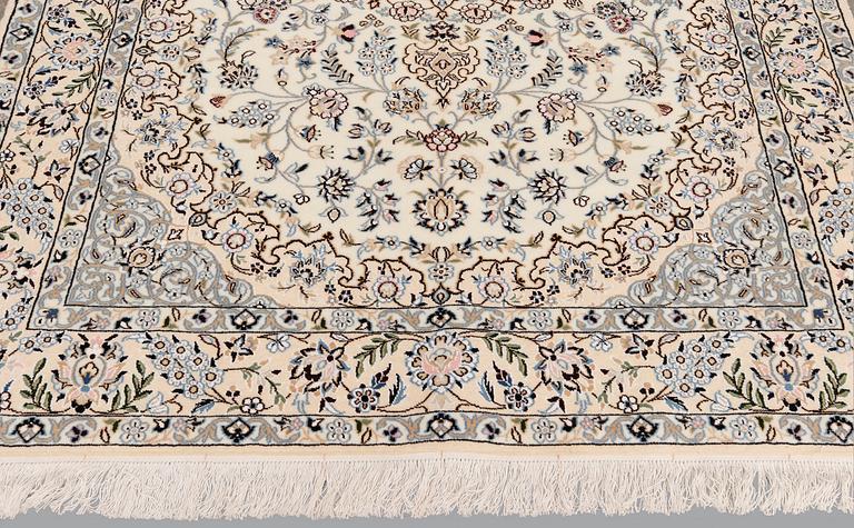 A Nain part silk carpet, 254 x 156 cm.