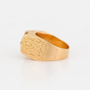 A ring with textured surface.