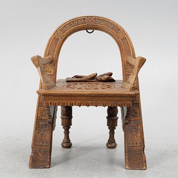 Armchair, after a design by Vasily Shutov called 'Arc, Axes and Mittens' Russia late 19th century.