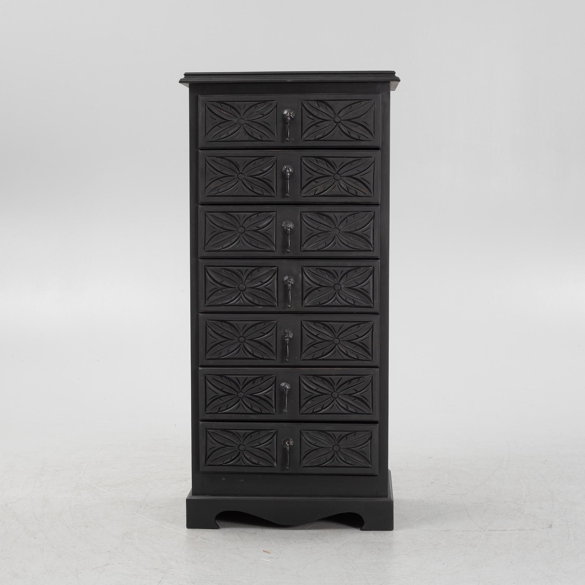 A carved and painted chest of drawers, late 20th Century.