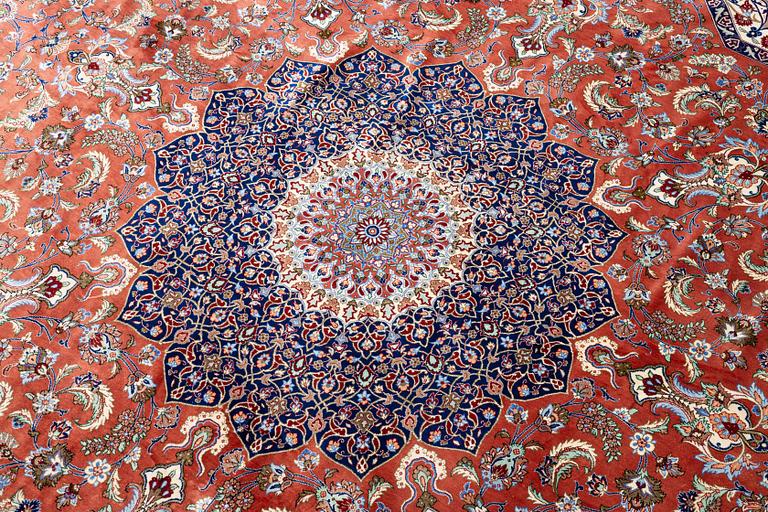 An Oktagonal  silk Qum rug, Central Persia, signed, c. 250 x 250 cm.