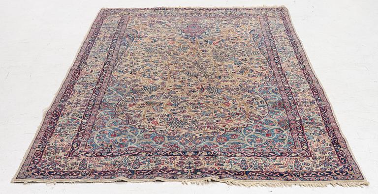 A semi antique Kirman rug, South Persia, c. 228 x 136 cm.