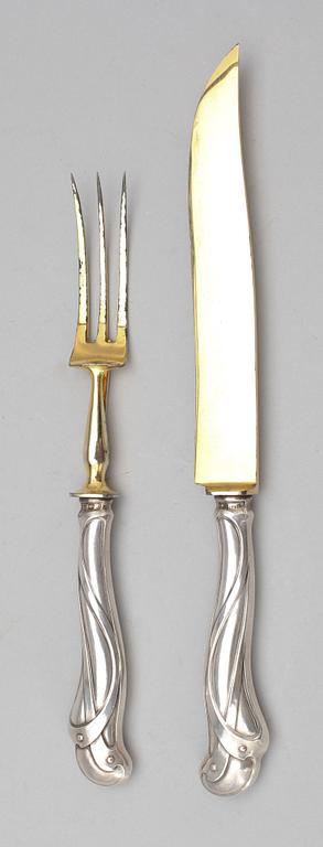 UPPLÄGGNINGSBESTICK, 2 st, silver, jugend, sannolikt Frankrike, 1900-tal.