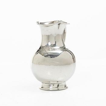 A British silver creamer, mark of Henry John Lias & Son, London 1875.