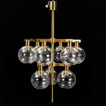 A brass chandelier with glass globes by Hans Agne Jakobsson, Markaryd.