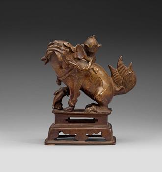 68. A bronze figurine of a mythological animal, presumably Ming dynasty (1368-1643).