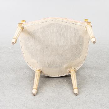 Dining table and armchair, Louis XVI style. Italy, second half of the 20th century.