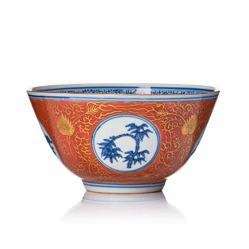 A blue and white bowl with coral red exterior, Japan, 19th century.