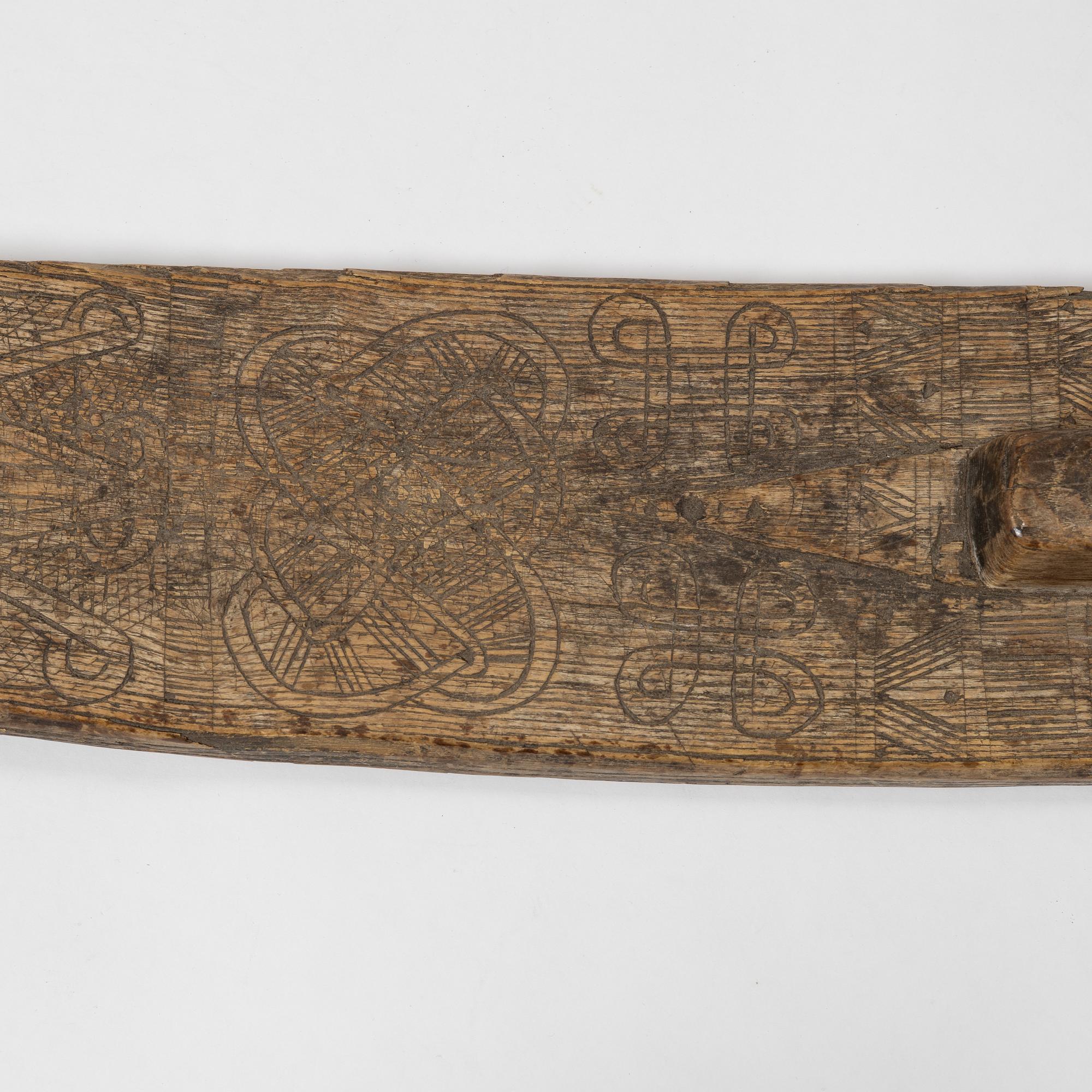 A Swedish folk art mangle board, dated 1666.
