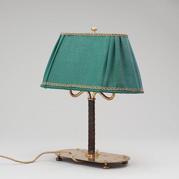 A Josef Frank brass and brown leather table lamp, model nr 2388, Svenskt Tenn 1940-50's.