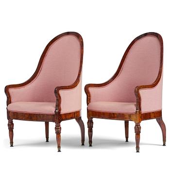 165. A pair of Baltic mahogany fauteuils, mid 19th century.