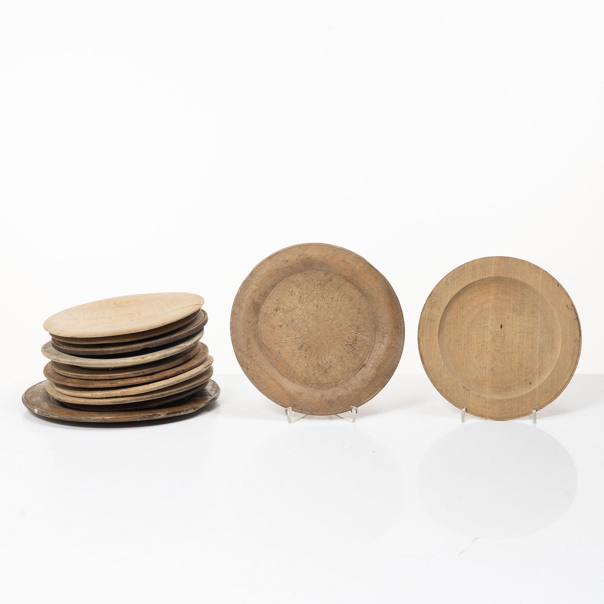 Twelve wooden plates, 19th Century.