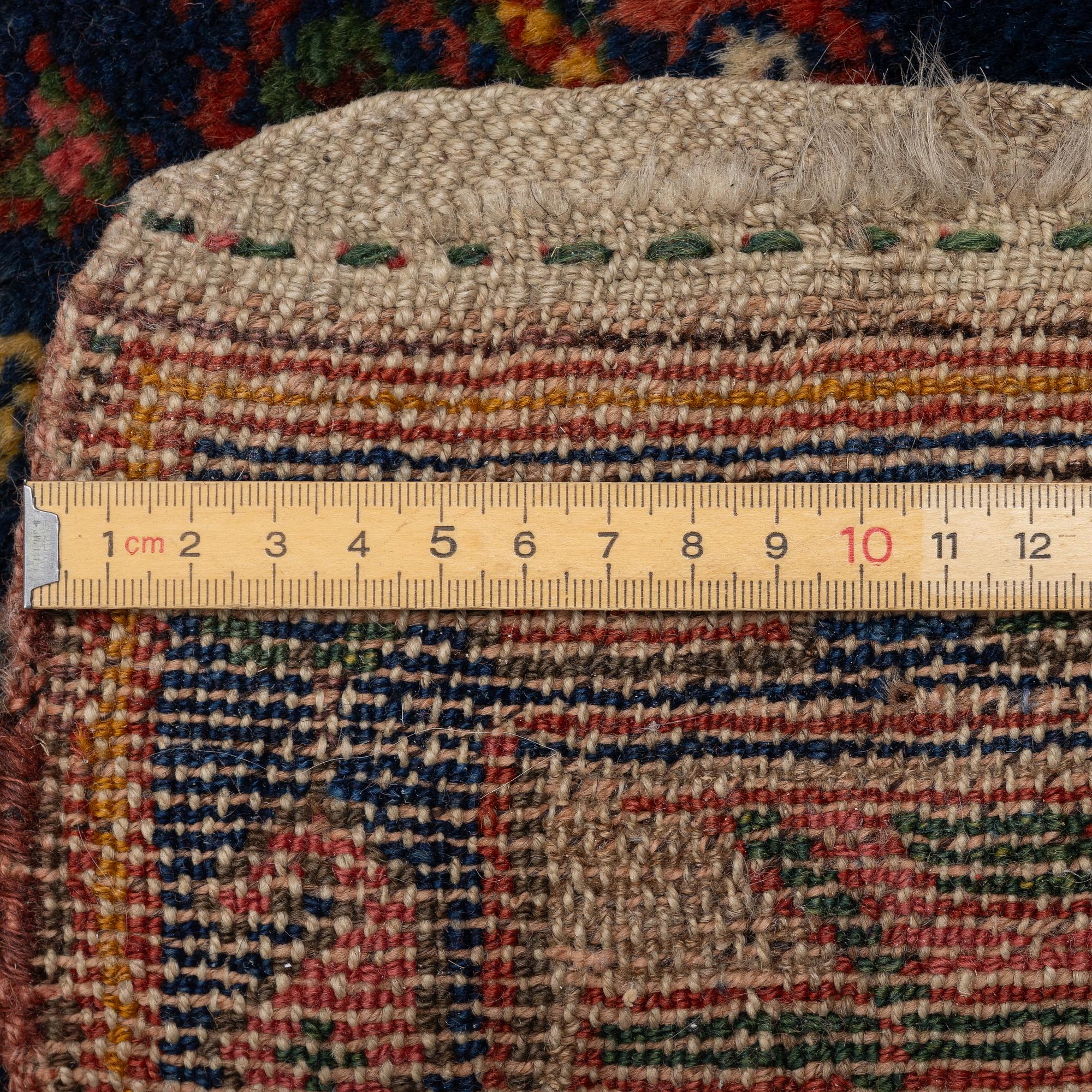 A semi-antique Northwest Persian runner, c. 388 x 94 cm.