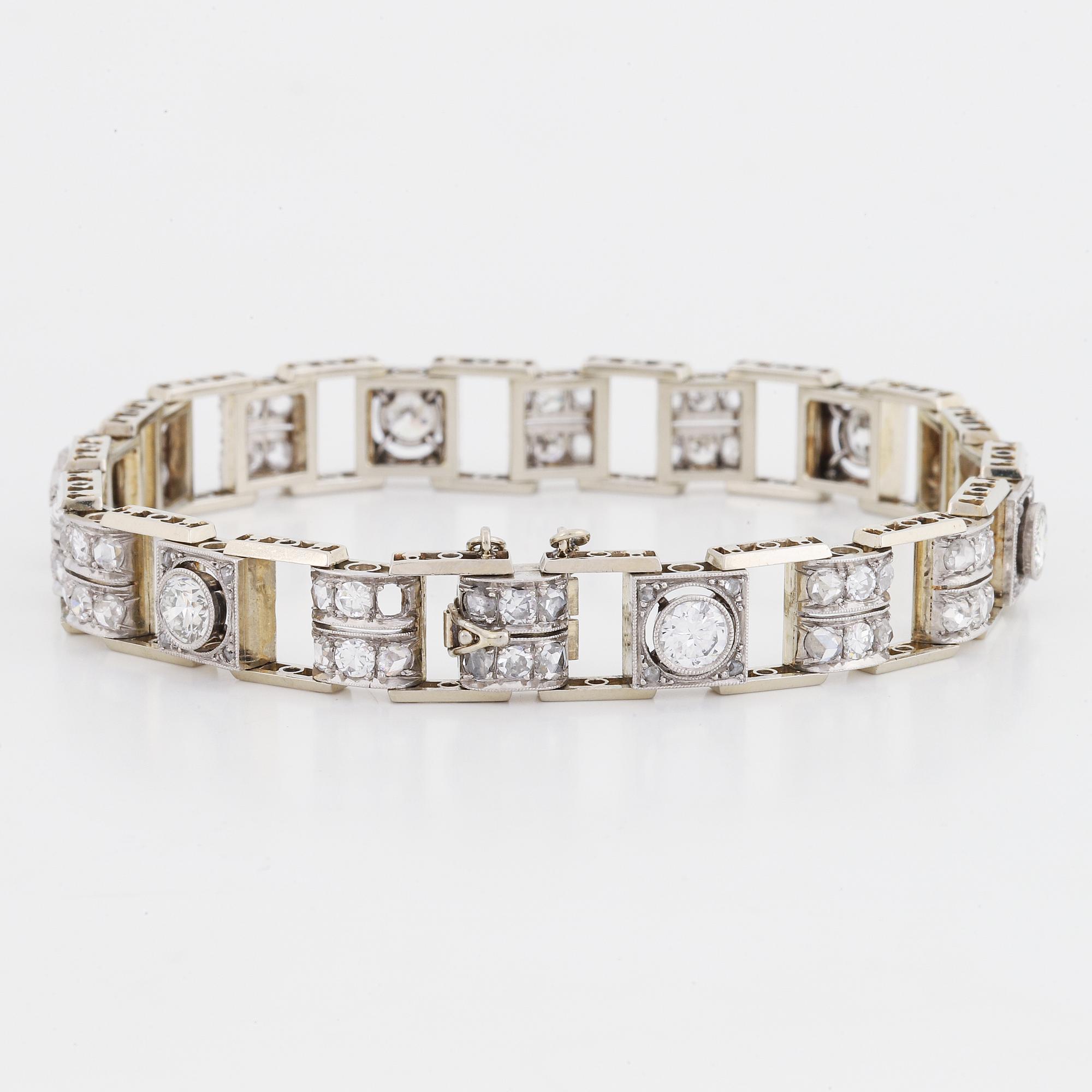 An 18K white gold bracelet set with old- and rose-cut diamonds.