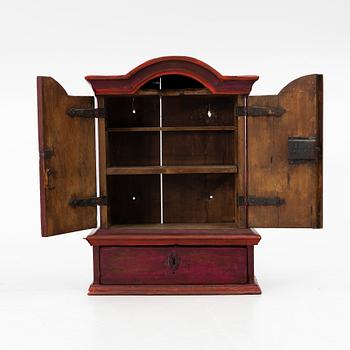 A 18th century Swedish wall-hanged cabinet.