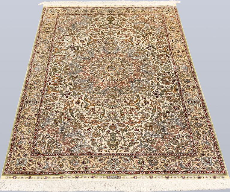 An Oriental silk rug, approx. 153 x 95 cm.