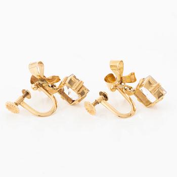 A pair of 18K gold earrings with faceted rock crystal.