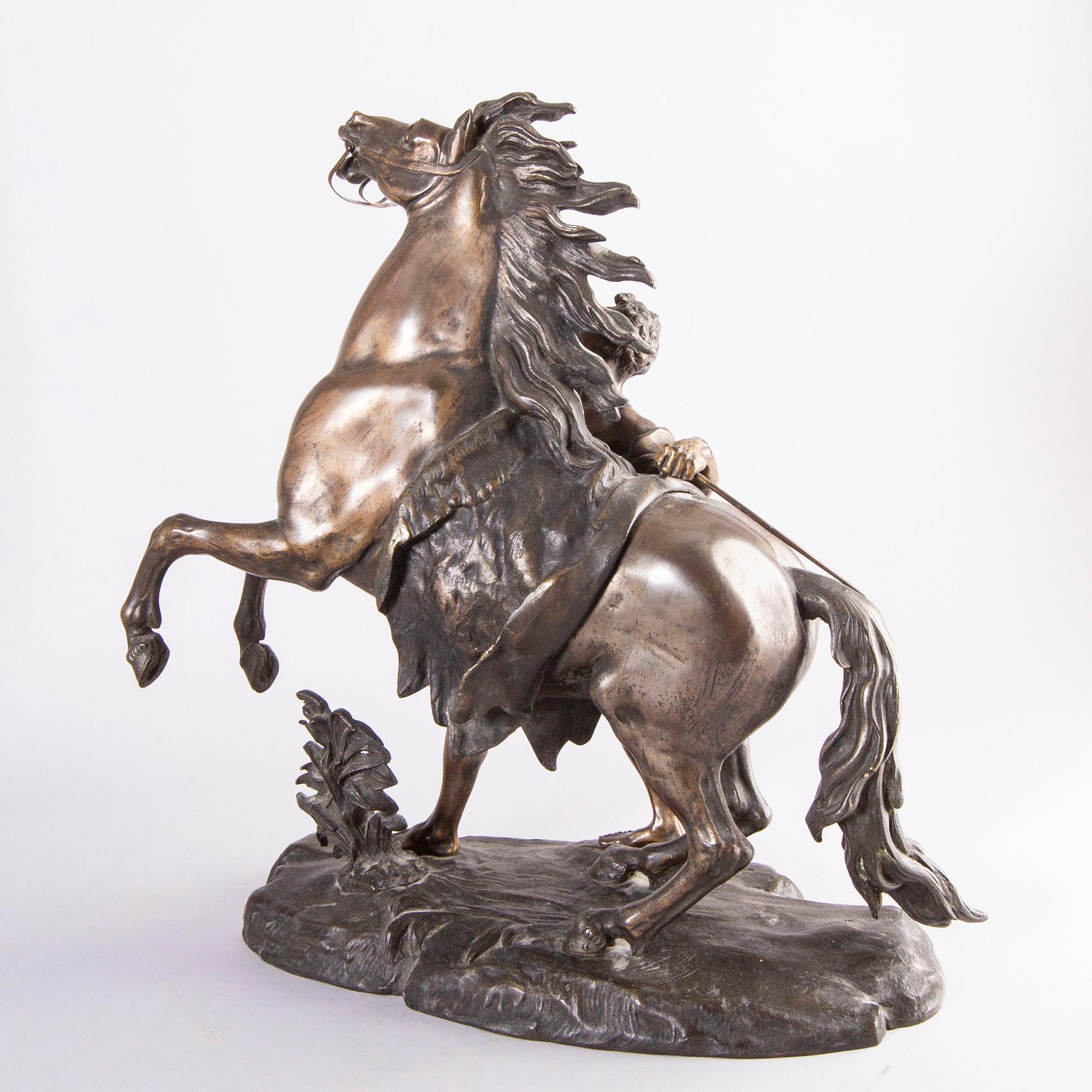 Guilliaume Coustou, after, a signed bronze sculpture  "Chevaux de Marly" from the second part of the 1800's.