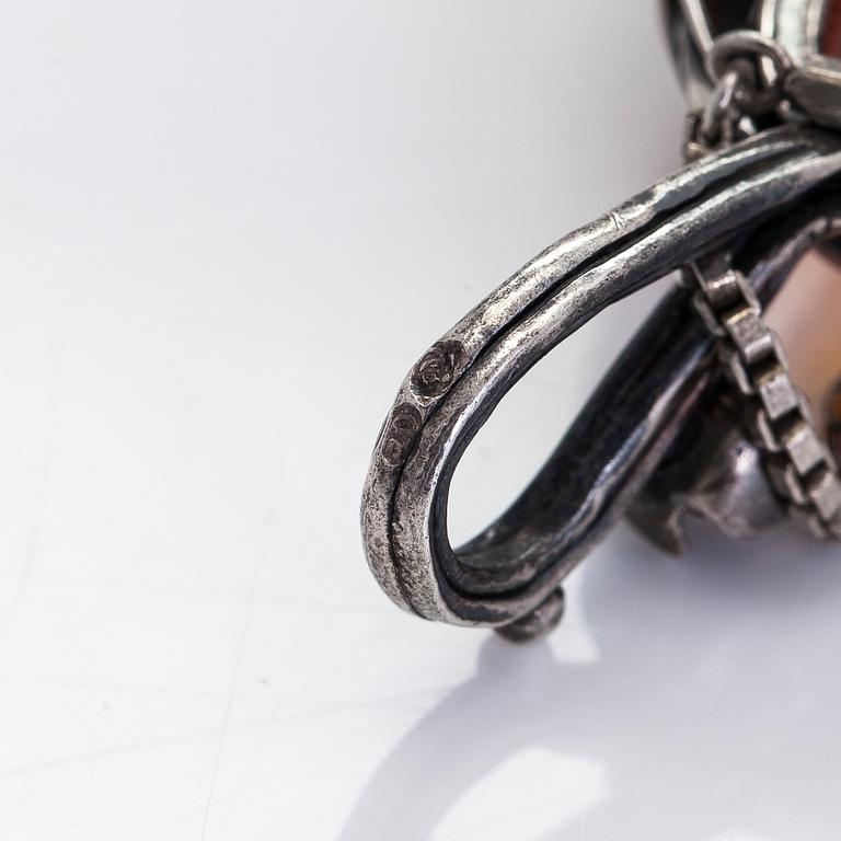 A silver and amber necklace, early 20th century. With later chain.