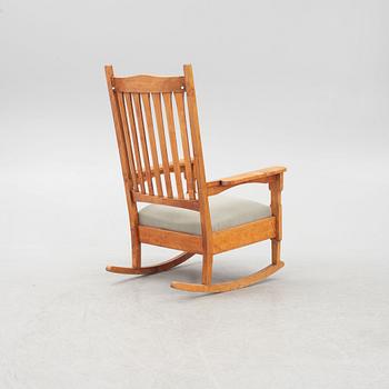 Gustav Stickley, after. A 'Bungalow Rocker' rocking chair, early 20th Century.