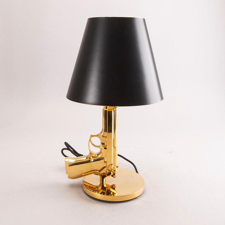 A Philippe Starck Gun bedside lamp for Flos 21st century.