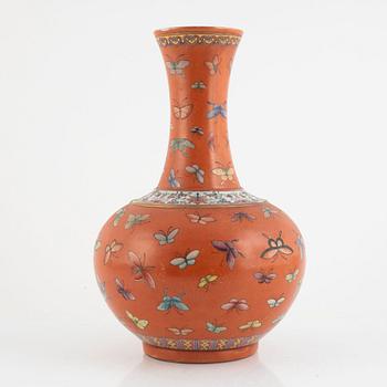 A Chinese coral read ground butterfly vase, 20th century.