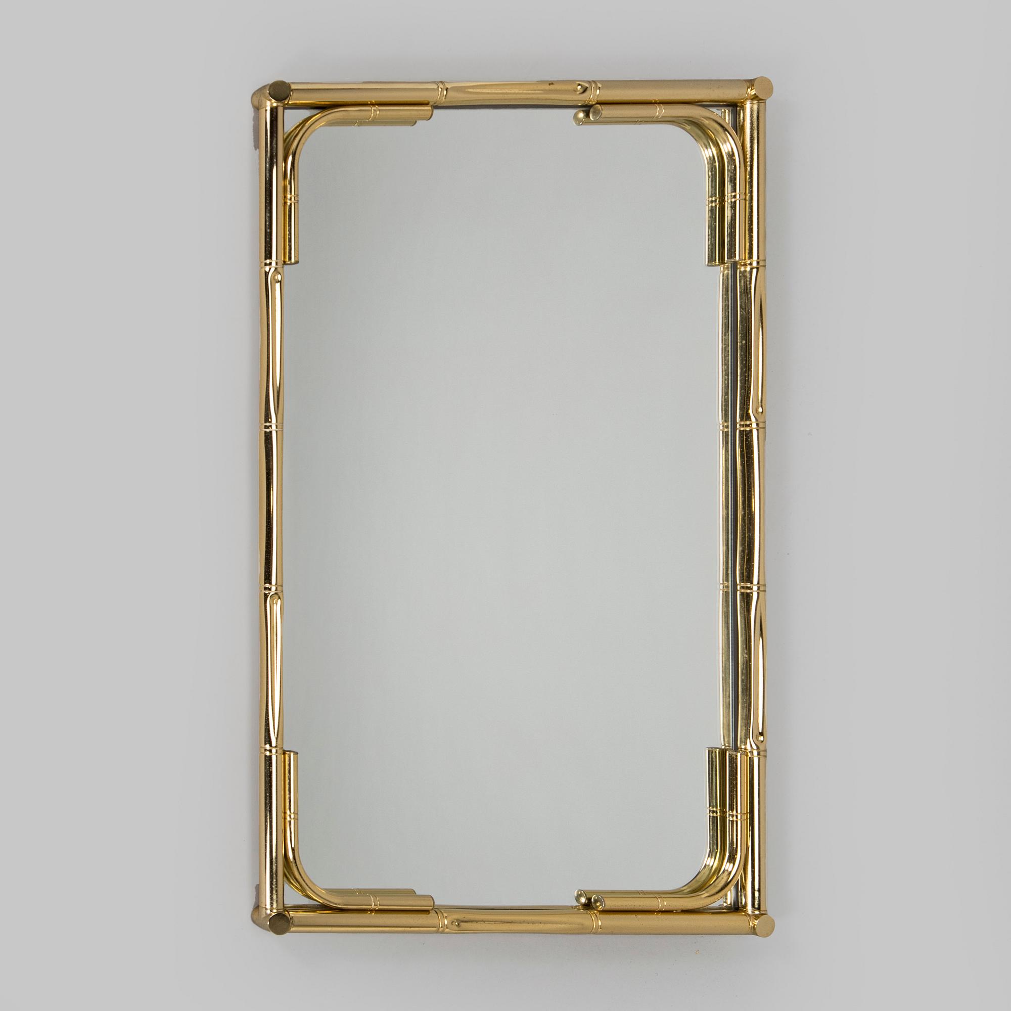 A 1970s/80s brass mirror.