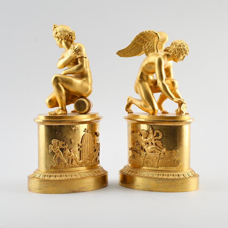 A pair of early 19th century Empire gilt bronze table sculptures.