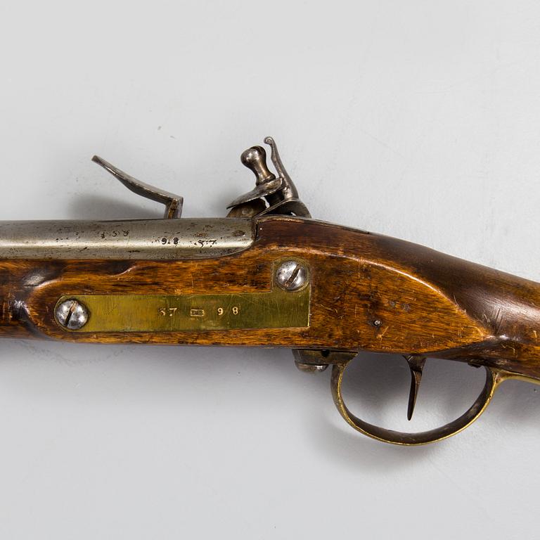 A late 18th century flintlock rifle.