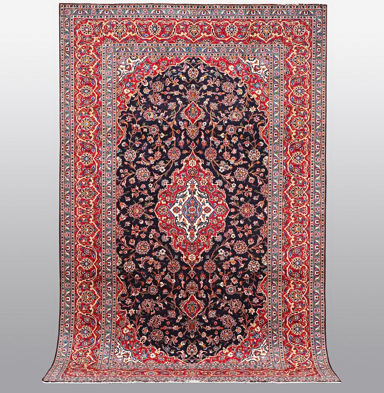 A carpet, Kashan signed Najafi, ca 360 x 231 cm.