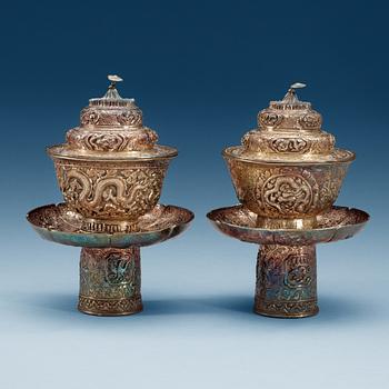 1518. A pair of silver cups with stands and covers, Tibet/Nepal.