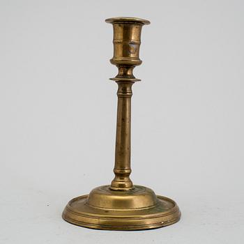 A 1500s bronze candlestick.