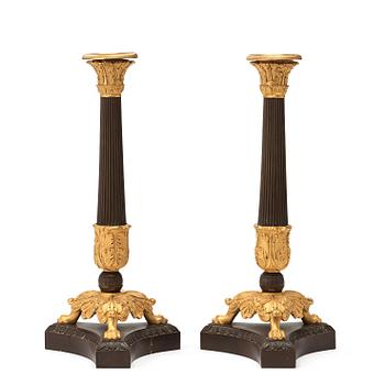 600. A pair of French late Empire 1820/30's candlesticks.