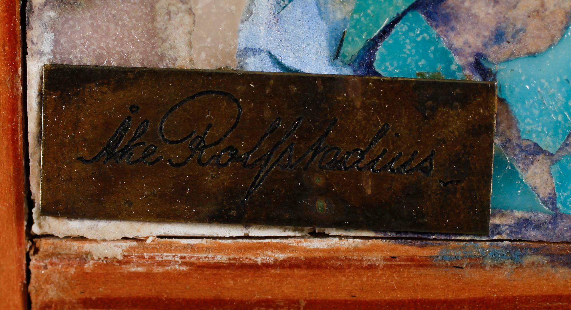 ÅKE ROLFSTADIUS, mosaik, signerad på mässingsplakett.