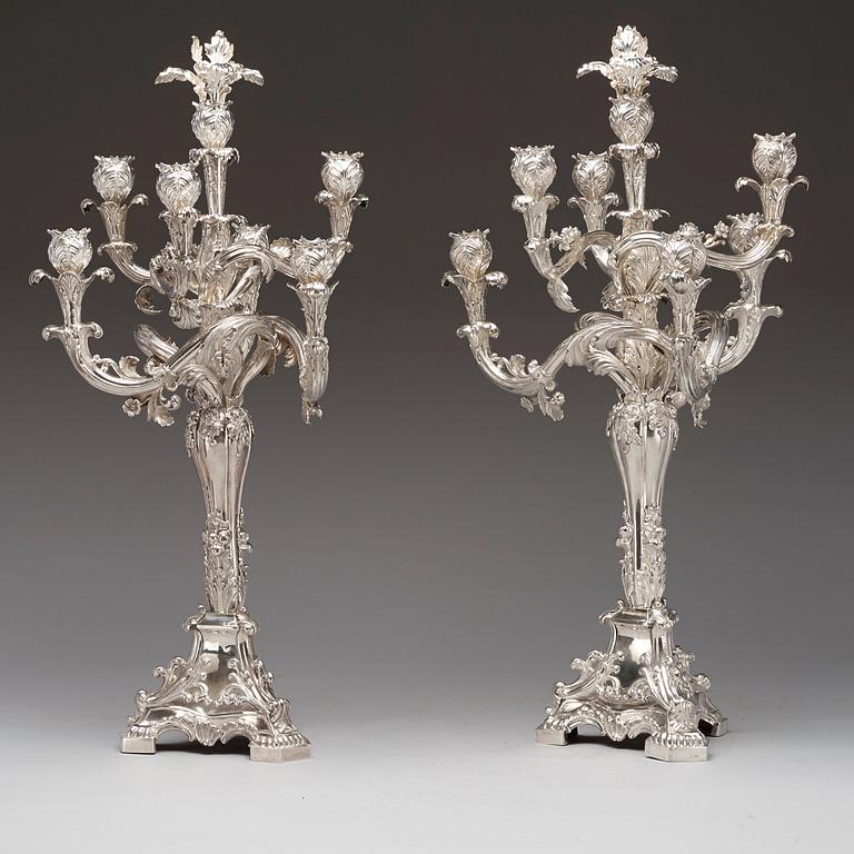 A pair of Swedish 19th century silver candelabras, marks of Gustaf Möllenborg, Stockholm 1845 and 1893.