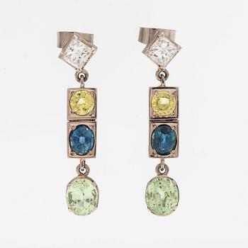 A pair of 14K white gold earrings with diamonds ca. 0.78 ct in total, sapphires and chrysoberylles.