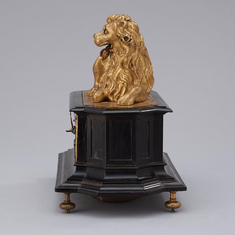A rare gilt brass on ebonised base Lion Automaton figure clock, Augsburg circa 1630.