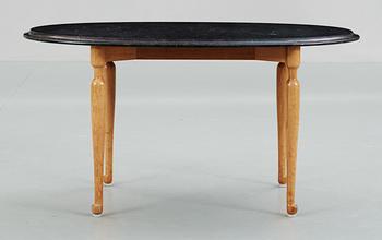 A Josef Frank black marble, mahogany and walnut table, Svenskt Tenn.