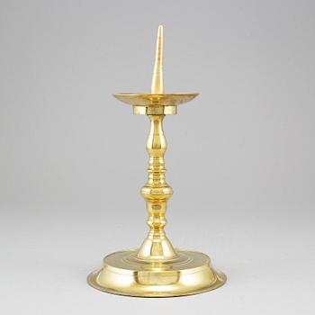 A 17th century bronze candlestick.