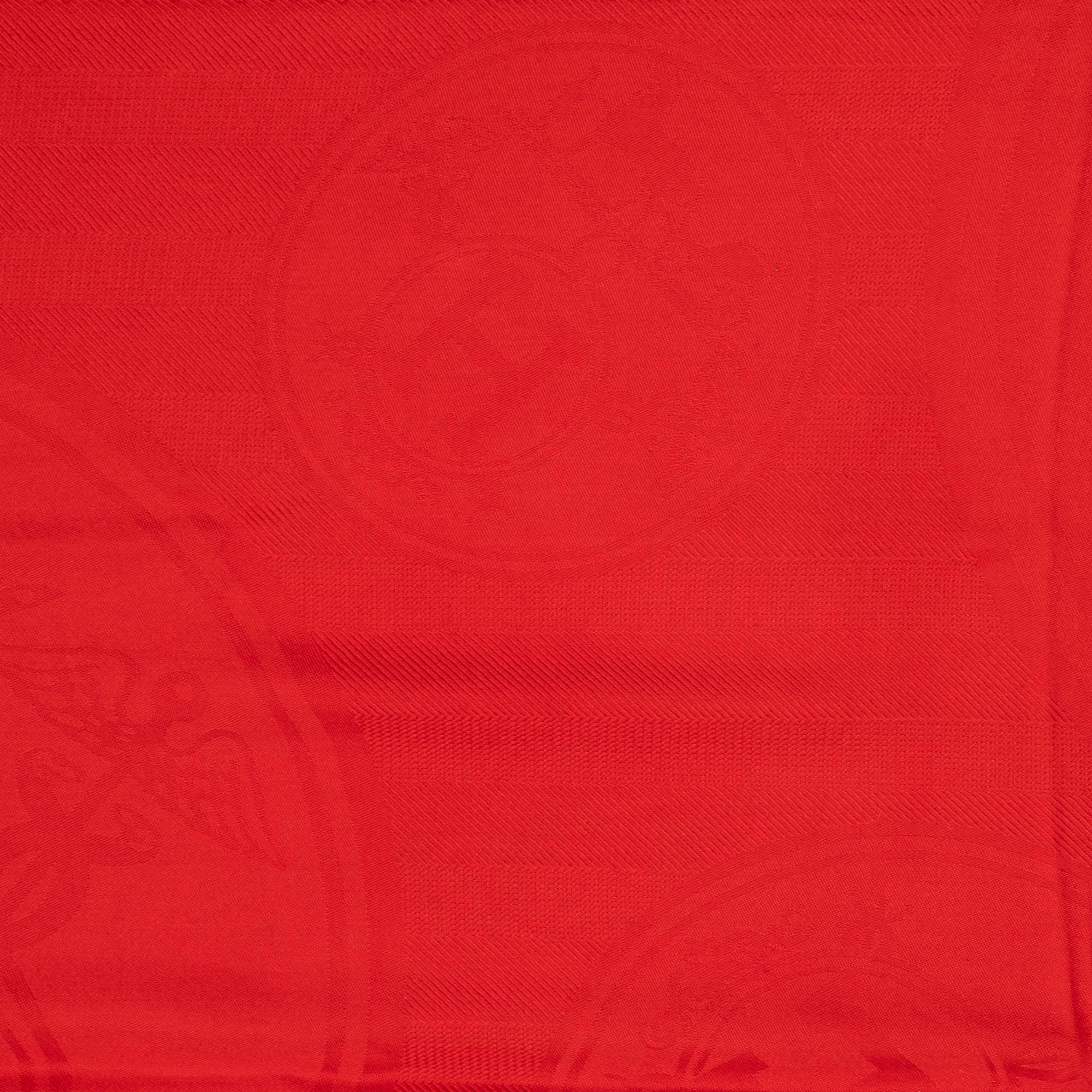 Hermès, a red cashmere and silk mix shawl.