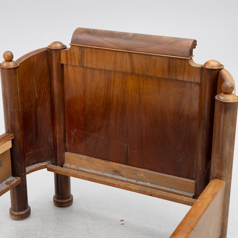 A late Empire bed, mid-19th century.