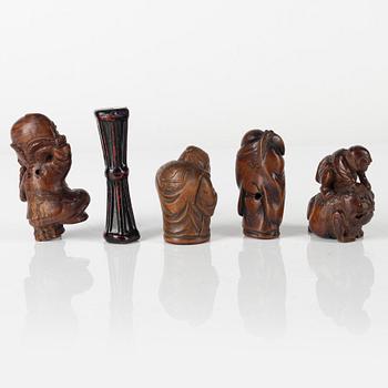 A group of five Japanese wood and lacquer figures / netsuke, 19th/20th century.