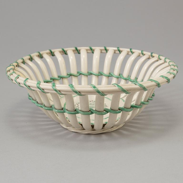 A CREAMWARE BASKET, PLATE AND A SIMILAR PLATE, one marked Wedgwood, first half of the 19th century.