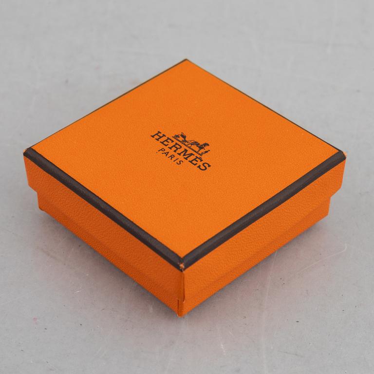 Hermès, a scarf ring.