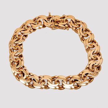 An 18K gold bracelet.