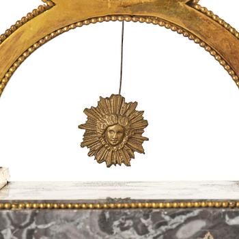 A French Louis XVI ormolu and marble lyre-shaped mantel clock, late 18th century.
