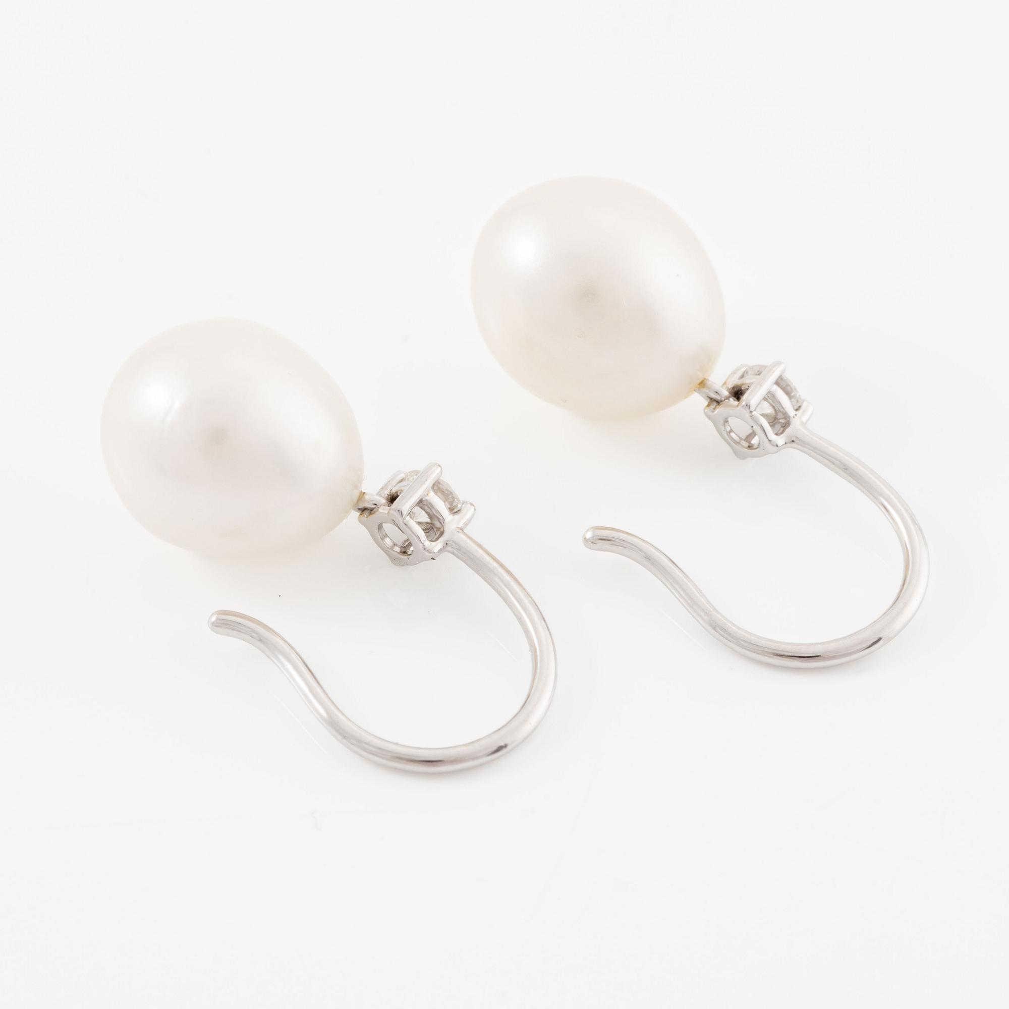 Earrings, 18K white gold with oval cultured pearls and brilliant-cut diamonds.